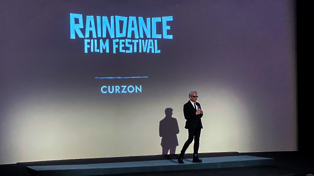 Man on stage at the Raindance Film Festival in London