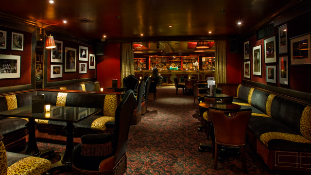 Low-lit interior of Ronnie Scott's jazz club in London
