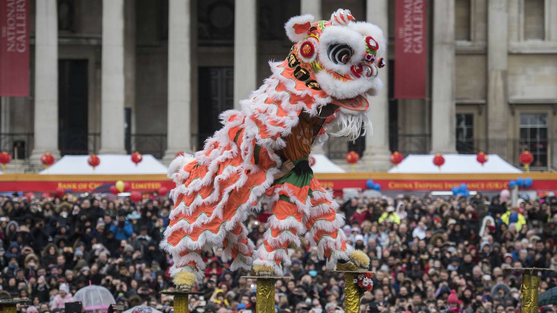 A lion dance takes place among the crowds during Chinese New Year in Trafalgar Square 2017. © Greater London Authority