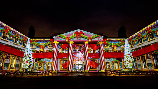 Kenwood House, a 17th century formely state home, is illuminated with projections of Christmas trees, candy bars and a big red bow.