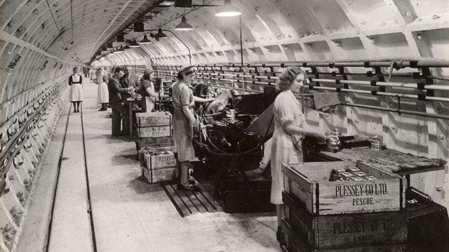 Factory workers at Plessey, 1941, as part of Hidden London: the Exhibition at the London Transport Museum