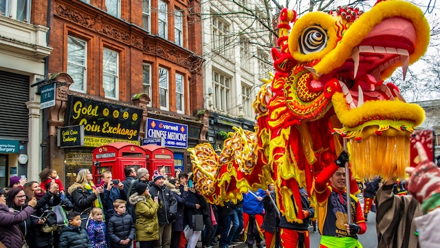 A dragon figure is paraded through the streets for Chinese New Year in London.