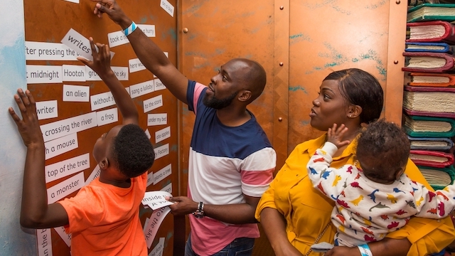 A family works on an activity together at Discover Children’s Story Centre in London.