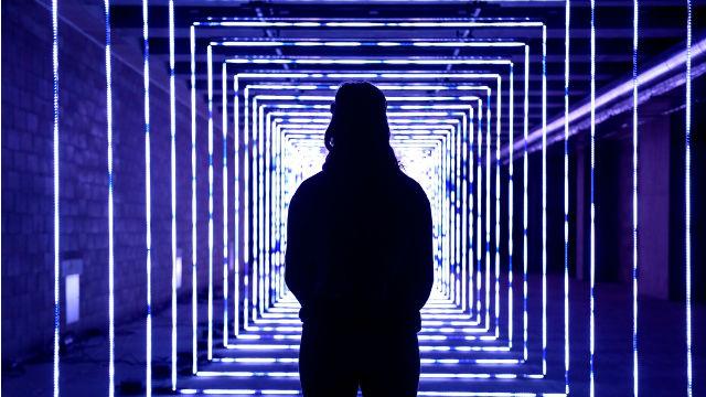 Man in front of tunnel of light