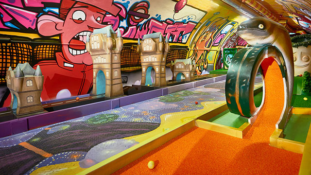 A hyper-coloured crazy golf course with graffiti and London-inspired obstacles