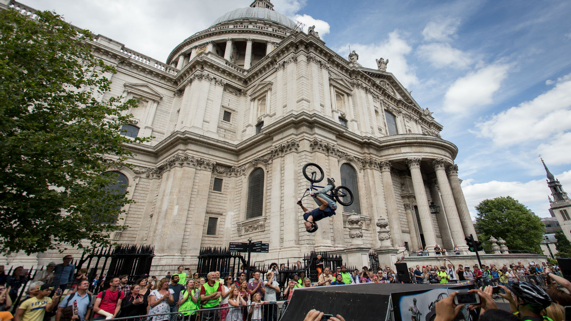 A cyclist does a backflip at the St Pauls Prudential RideLondon Festival Zone. Image courtesy of RideLondon