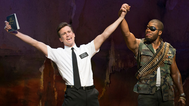 Two actors on stage during a performance of The Book of Mormon at the Prince of Wales Theatre in London.