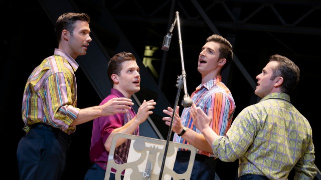 Four male actors singing in the hit musical, Jersey Boys.