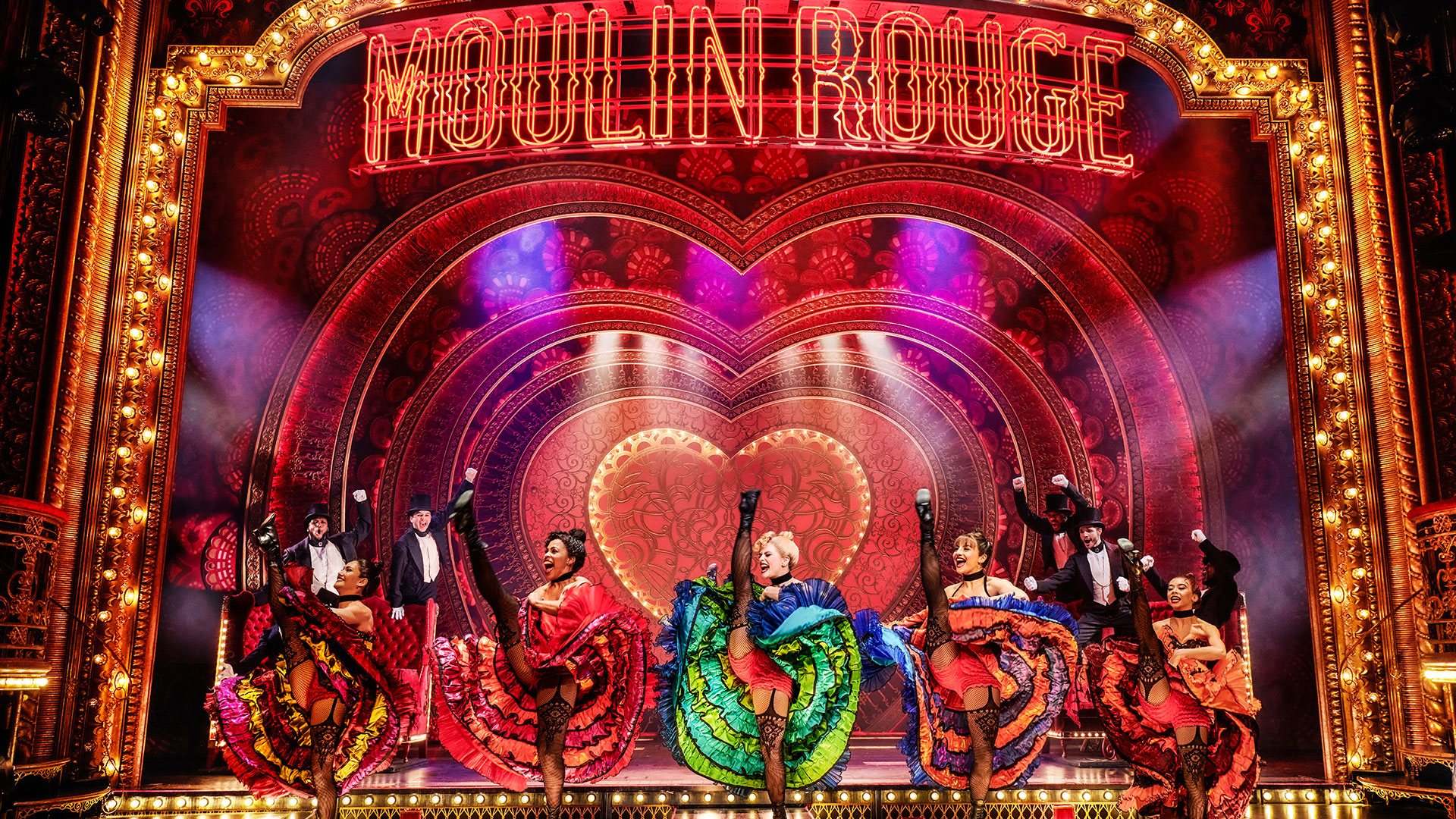 French Cancan at Moulin Rouge The Musical. Image courtesy of Dewynters. The good witch glenda and wicked with elphaba from london musical Wicked at the Apollo Victoria Theatre.