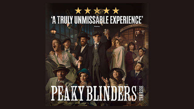 The cast of Peaky Blinders The Rise on stage all wearing 1920s clothing, with the actor portraying Tommy Shelby at the centre.