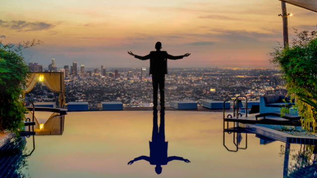 Tartuffe promotion poster - a man overlooking the city.