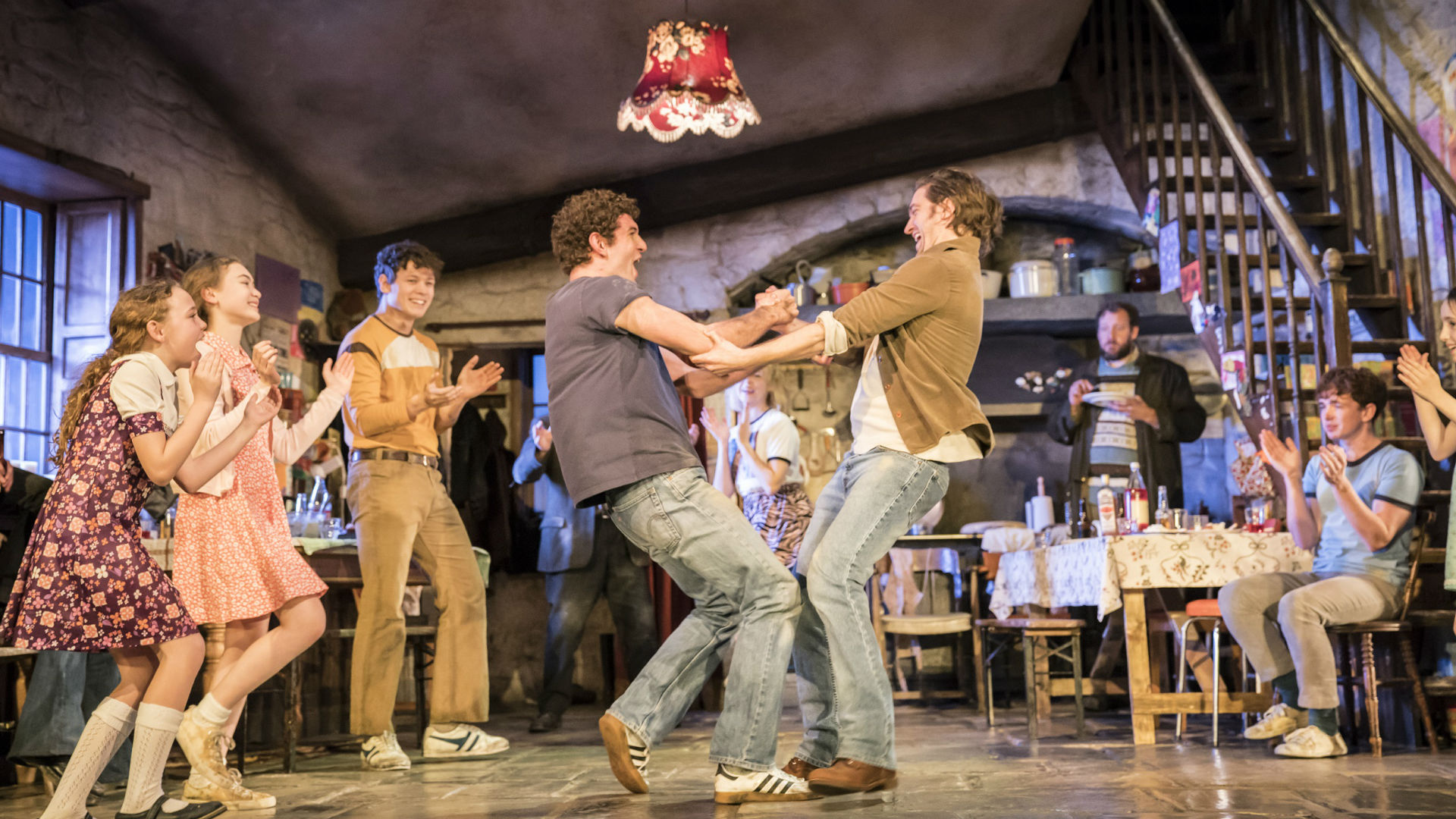 The cast dance on stage during The Ferryman at Gielgud Theatre. Photo credit: Johan Persson. Image courtesy of The Corner Shop PR.