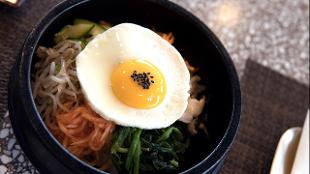 A fried egg tops Korean food at Olle. Image courtesy of Street & Co