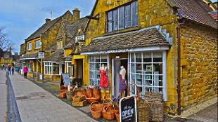 Shops in a Cotswolds village © Shutterstock. Image courtesy of Golden Tours.
