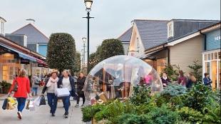 Explore luxury fashion and lifestyle boutiques at Bicester Village. Image courtesy of Mastercard.