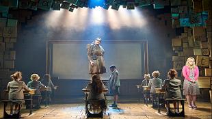 Elliot Harper stars as Miss Trunchbull in Matilda The Musical. Image courtesy of See Tickets.