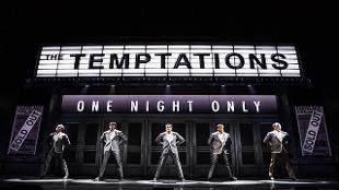The cast playing The Temptations in the musical Ain't Too Proud stand on stage at the Prince Edward Theatre. Photo credit Matthew Murphy. Image courtesy of See Tickets.