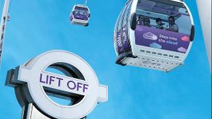 The purple IFS cable cars fly over the Thame in London, image courtesy of TFL