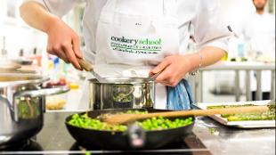 Cooking at Cookery School. Image courtesy of Cookery School at Little Portland Street.