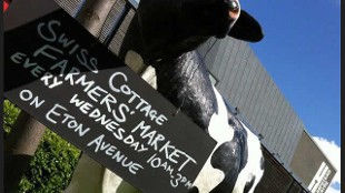 A sign advertising Swiss Cottage Farmers' Market. Image courtesy of Swiss Cottage Farmers' Market
