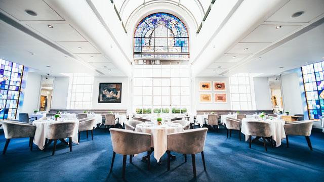 Tables in the dining room beneath a stained glass window. Image courtesy of Claude Bosi at Bibendum. Tables in the dining room beneath a stained glass window. Image courtesy of Claude Bosi at Bibendum.