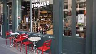 Chairs and tables outside Champagne + Fromage. Image courtesy of Champagne + Fromage.
