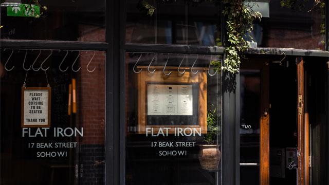 The entrance to Flat Iron Soho. Image courtesy of Flat Iron.