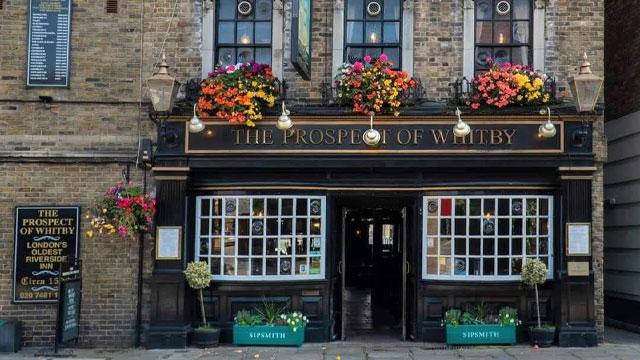The outside of the pub decorated with hanging baskets and planters. Image courtesy of Greene King. The outside of the pub decorated with hanging baskets and planters. Image courtesy of Greene King.