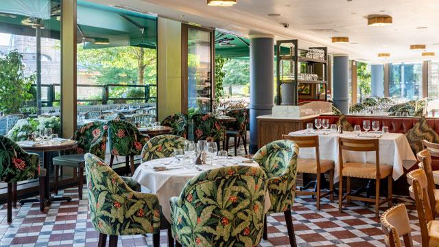 Tables and chairs in the colourful dining room. Image courtesy of The Ivy Collection. Tables and chairs in the colourful dining room. Image courtesy of The Ivy Collection.