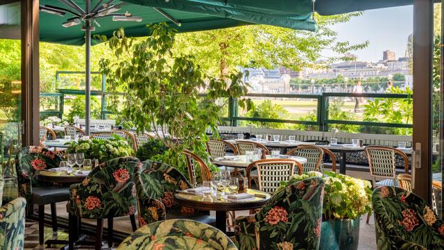 Tables next to windows overlooking the outside area. Image courtesy of The Ivy Collection. Tables next to windows overlooking the outside area. Image courtesy of The Ivy Collection.