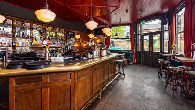 The wood pannelled bar. Image courtesy of McMullen & Sons. The wood pannelled bar. Image courtesy of McMullen & Sons.