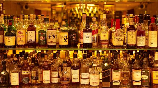Bottles of whisky stocked on shelves at the Whisky Bar at The Athenaeum in London's Mayfair.